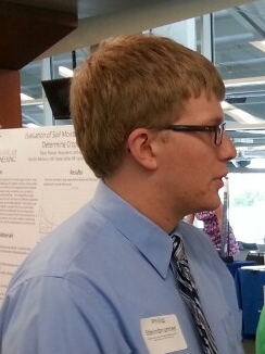 Photo of Phillip S during poster session presenting EnSURE work