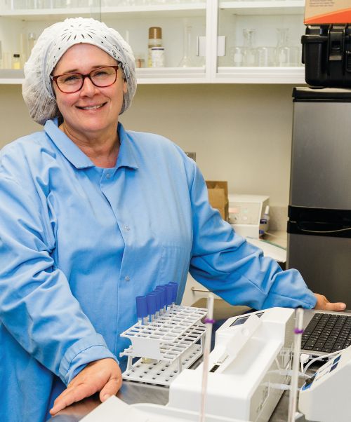 Tina Conklin, a food processing specialist at MSU, works on a project looking at shelf life and packaging concerns associated with uncured vacuum-packaged meat products.