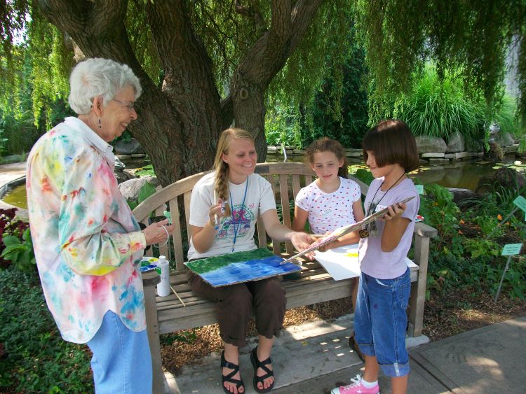Linda Nelson and Jessica Wright teaching watercolor painting at Camp Monet at the Michigan 4-H Children’s Gardens.