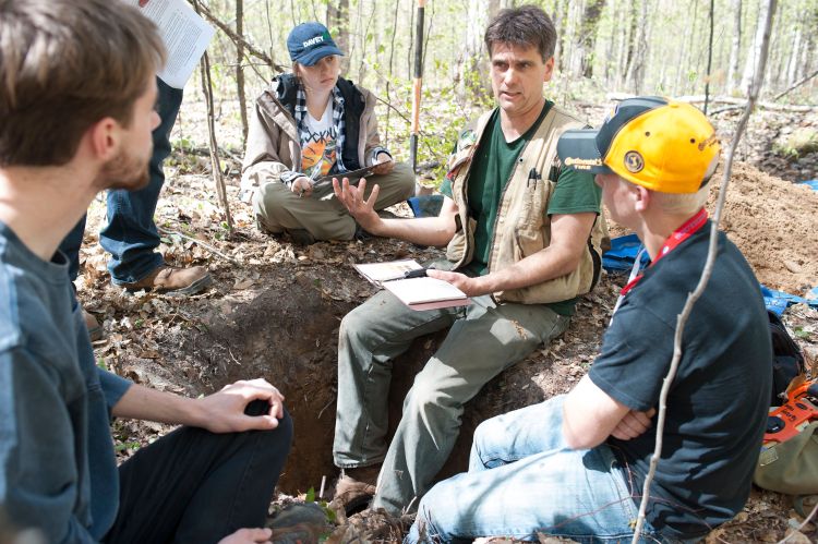 David Rothstein, professor in the MSU Department of Forestry, talks with students about forest soils during the Forestry Field Studies (FOR 420) course in summer 2017. Pictured left to right: Nick Russo, Taylor Hess, David Rothstein and Levi Churches.