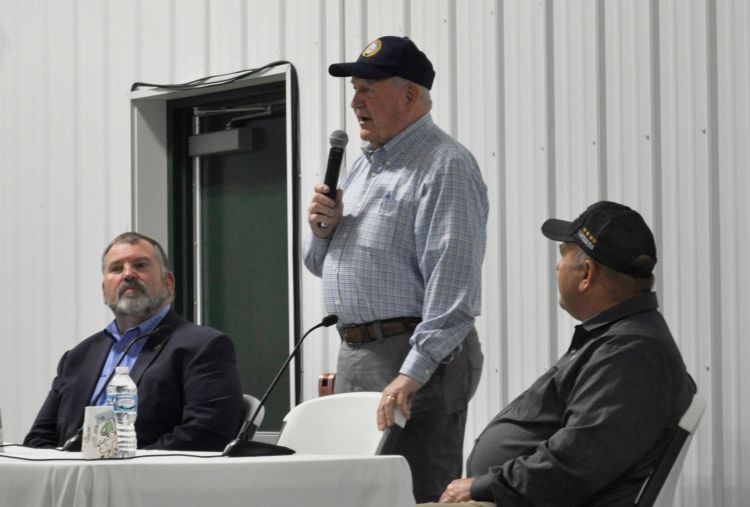 Sonny Perdue (center) answers questions from farmers at the Saginaw Valley Research and Extension Center. The town hall was moderated by Michigan Farm Bureau President Carl Bednarski (left). Zippy Duvall (right), president of the American Farm Bureau Federation, also answered audience questions.