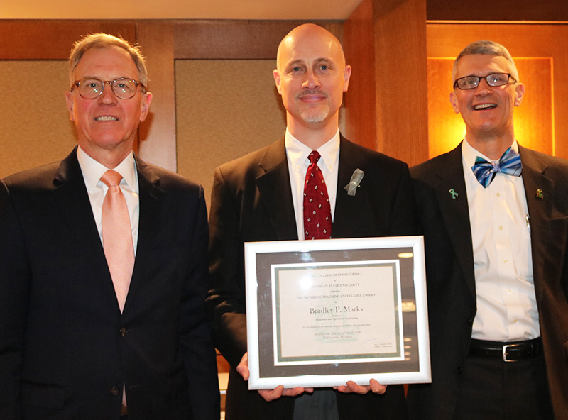 Photo of Dr. Marks Receiving Withrow Teaching Award 
