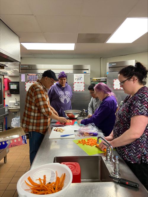 Community members prepare a recipe at the Little Traverse Bay Bands of Odawa Indians Government Center.