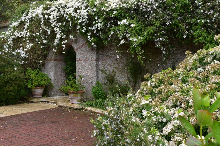 Photo 1. Gateway leading to another garden at Le Bois des Moutiers.