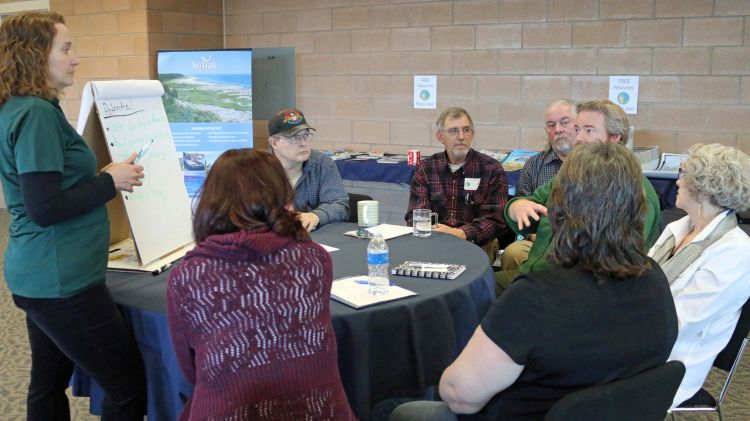 MSU Extension educator Tracy D'Augustino (standing) works with teachers during the recent Northeast Michigan Great Lakes Stewardship Initiative network meeting. Photo: Michigan Sea Grant