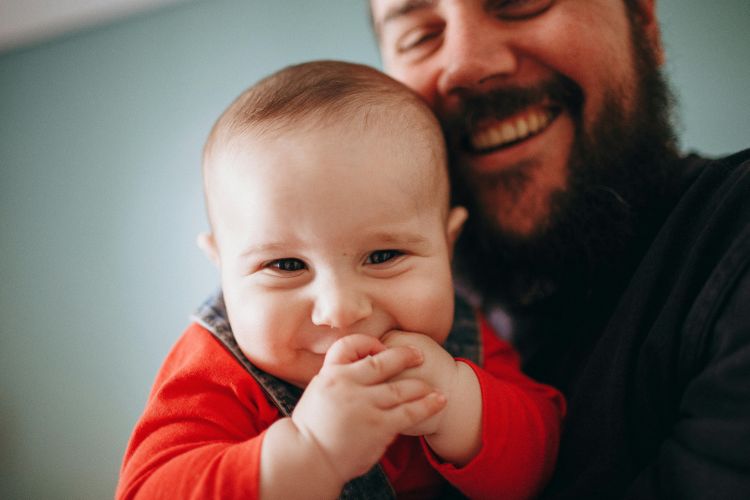 Bearded Man Carrying his Son