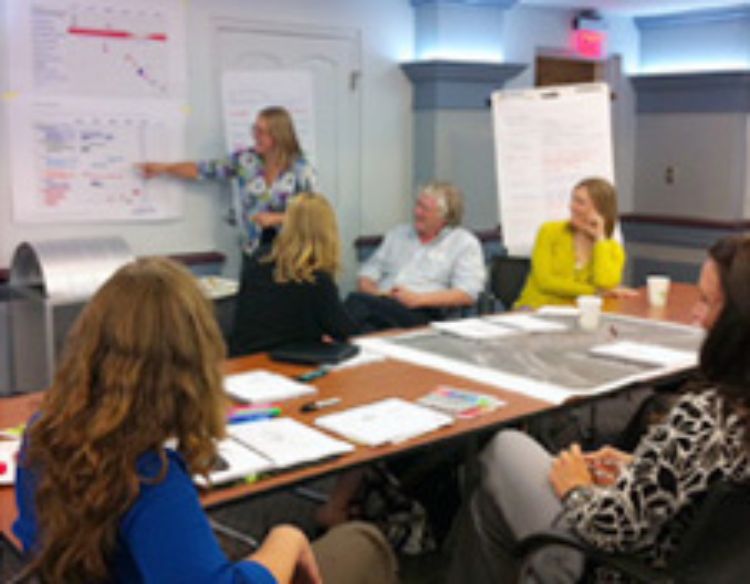 Attendees of the MSU Extension training by NCI, listening to a presenter.