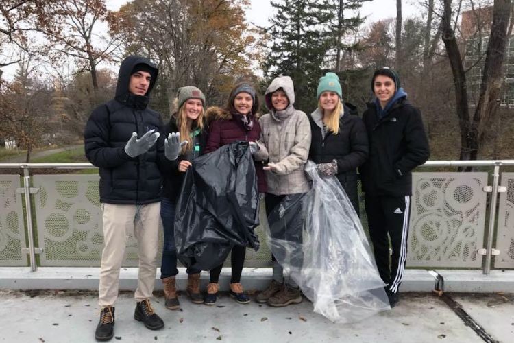 Pummell working to clean up campus with fellow students.