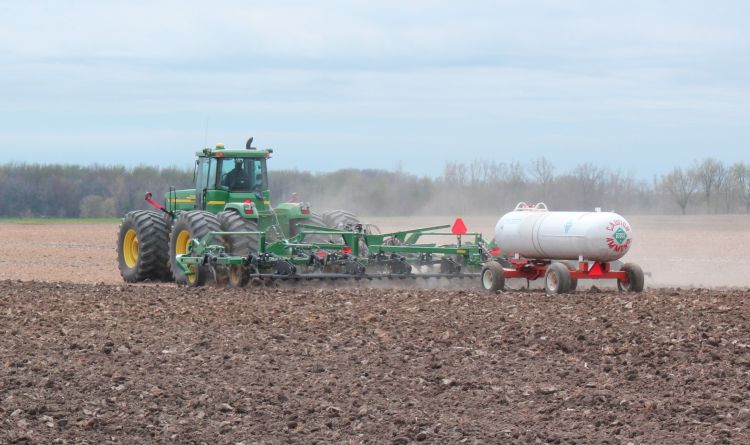 Applying anhydrous ammonia to corn field