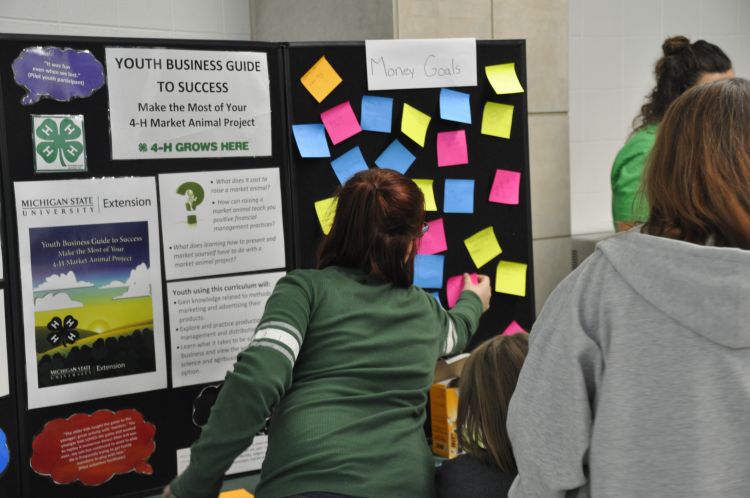 Writing financial goals at booth