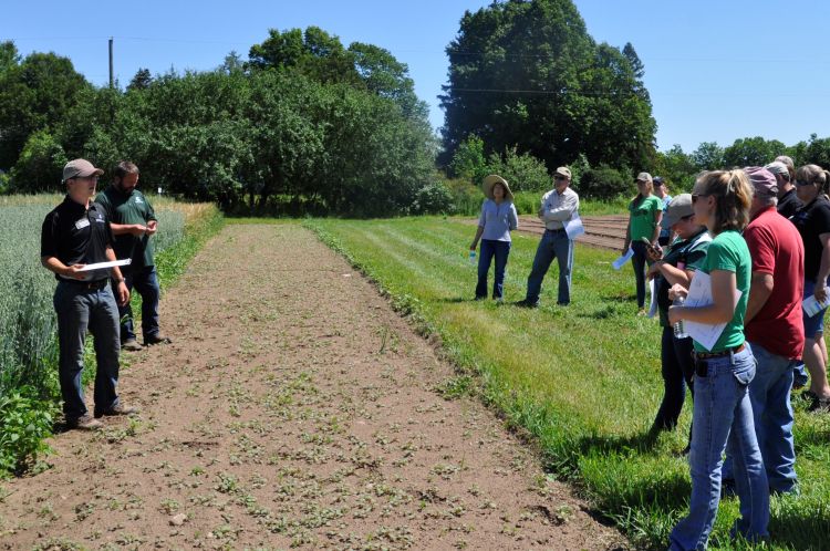 Researchers Colin Thompson (left) and Chris Kapp (second from left) presenting research at the Upper Peninsula Research and Extension Center.