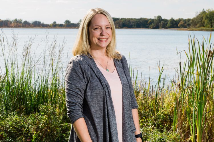 Jo Latimore standing in front of a lake