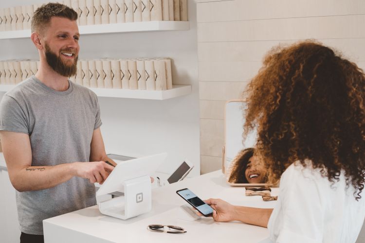 Cashier smiling at a customer