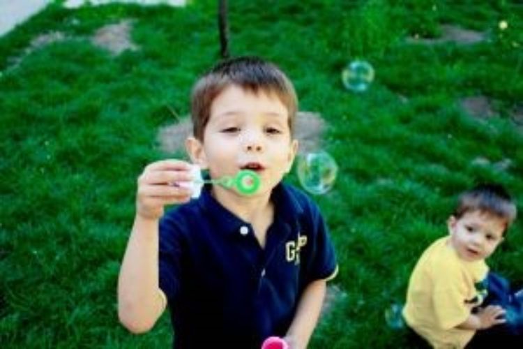 Boy blowing bubbles