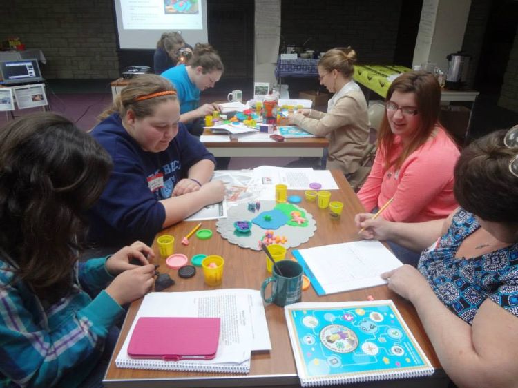 Curriculum training participants working.