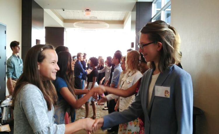 Girls shaking hands