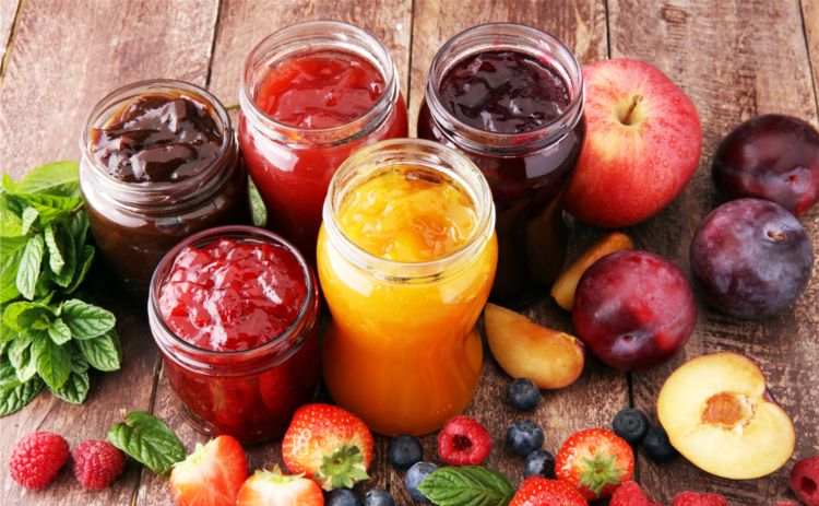 Various canned fruits on a table.