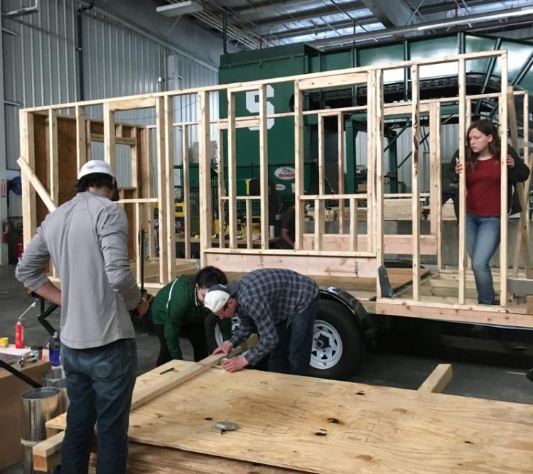 Students from the MSU School of Planning, Design and Construction cut boards for their tiny house. Courtesy April Van Buren.
