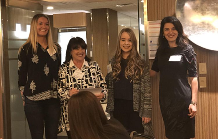 Image of scholarship recipient senior Rachel Boerma, a PWB professional, scholarship recipient master's student Hannah Baird, and CM associate professor Sinem Mollaoglu at the kick-off event.