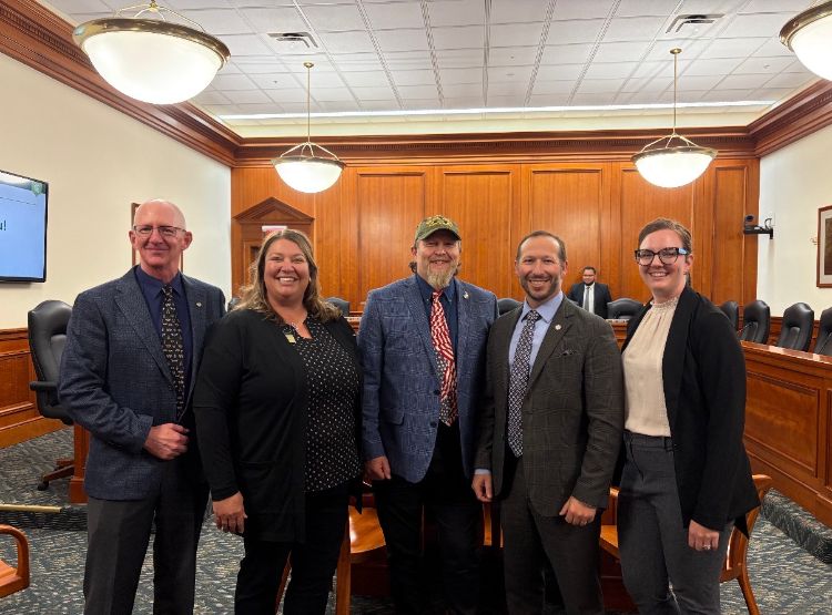 Rufus Isaacs and Jackie Perkins pose with other MSU experts