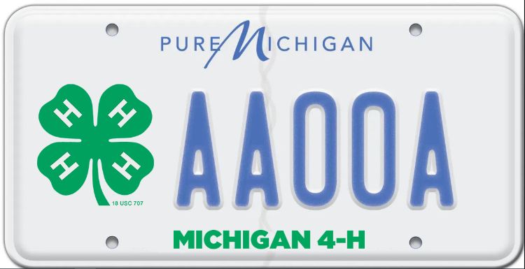 A white plate with blue letters and the words Pure Michigan in blue across the top. Along the bottom in green are the words Michigan 4-H and on the left is a large 4-H clover.