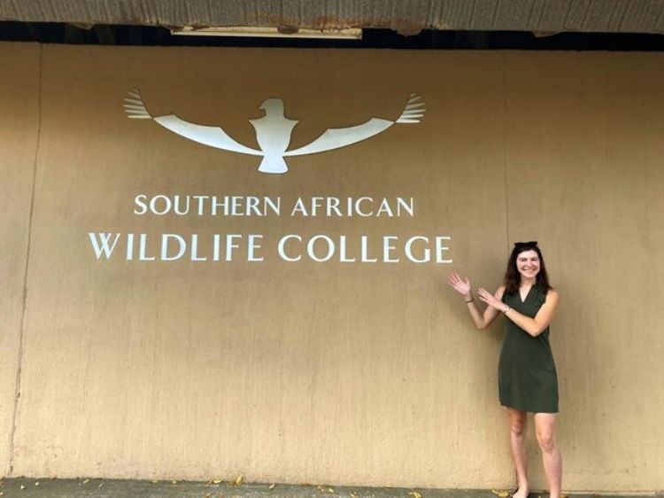 Francine Barchett standing in front of the South African Wildlife College.