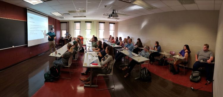 Aaron McKim teaching in a classroom prior to the pandemic