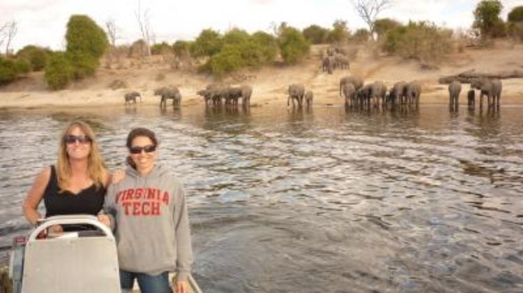 CHANS-Net researcher Kathleen Alexander (left), of Virginia Tech, and Risa Pesapane, a former master's student, at the study site in Botswana. Researchers have discovered that humans are passing antibiotic resistance to wildlife, especially in protected areas where numbers of humans are limited.