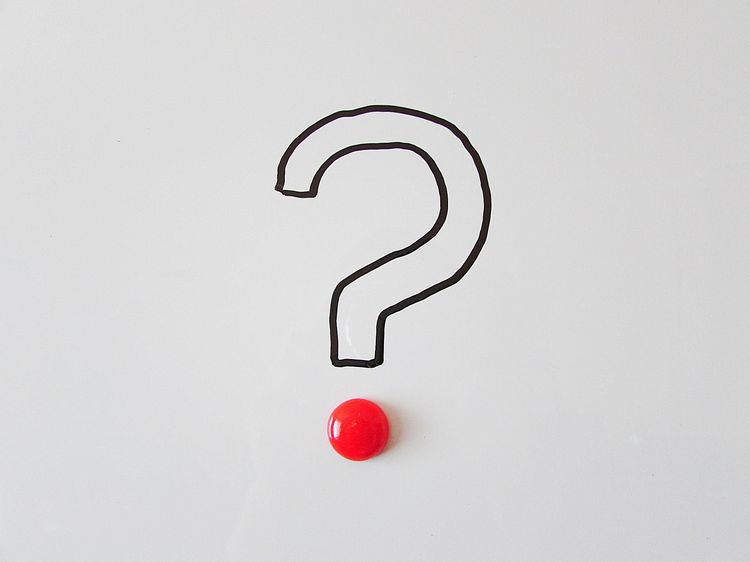 A black question mark with a red dot at the bottom.