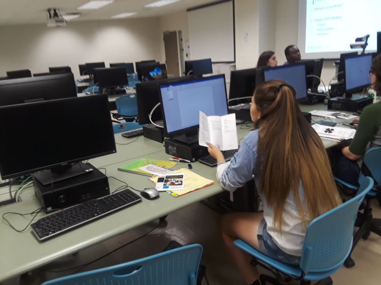 Youth sitting at computer