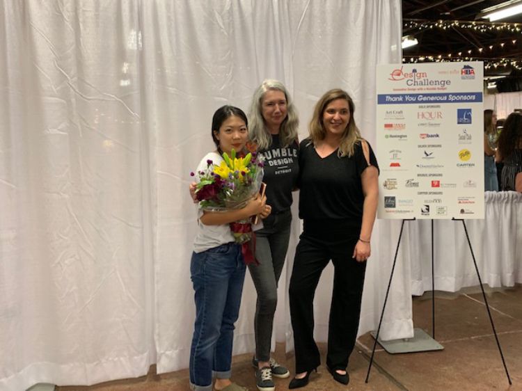 The first place team includes Gyuri Jang (senior/pictured holding flowers), and Dima Alnajjar and Julia Kassel (juniors) (not pictured).