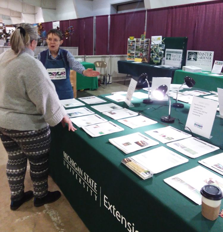 Deb Kinzi, Extension Master Gardener trainee, assists with Smart Gardening advice.