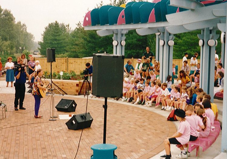 Children listening to music performers