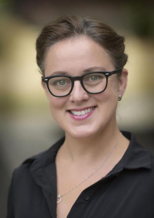 woman in glasses smiling