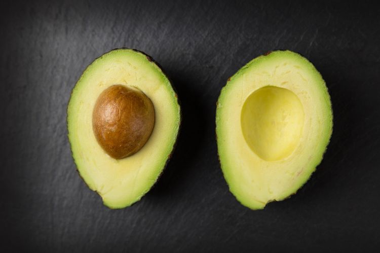 An avocado cut in half.