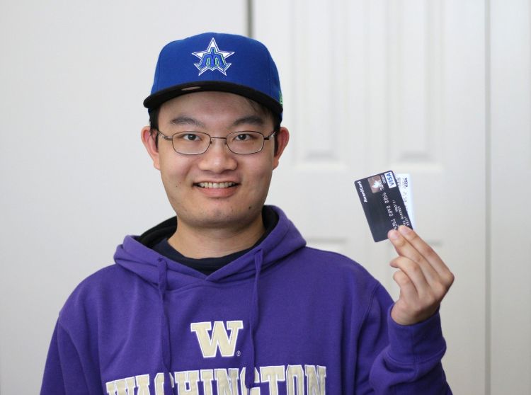 Youth holding a credit card