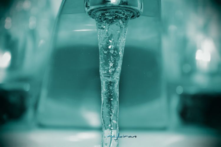 Water flowing from faucet.