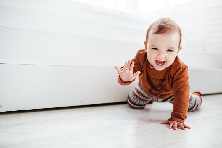 Baby crawling on floor