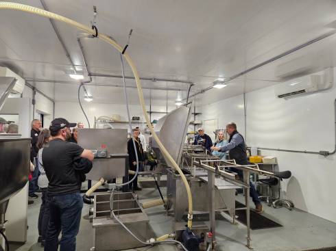 People view MSU Pollinator Performance Center's honey processing room.