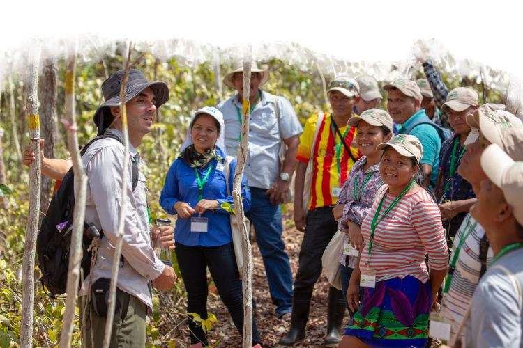 Jacob Slusser speaks with community members in Panama in the field