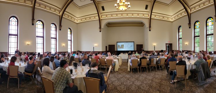 Participants sitting in a conference room.