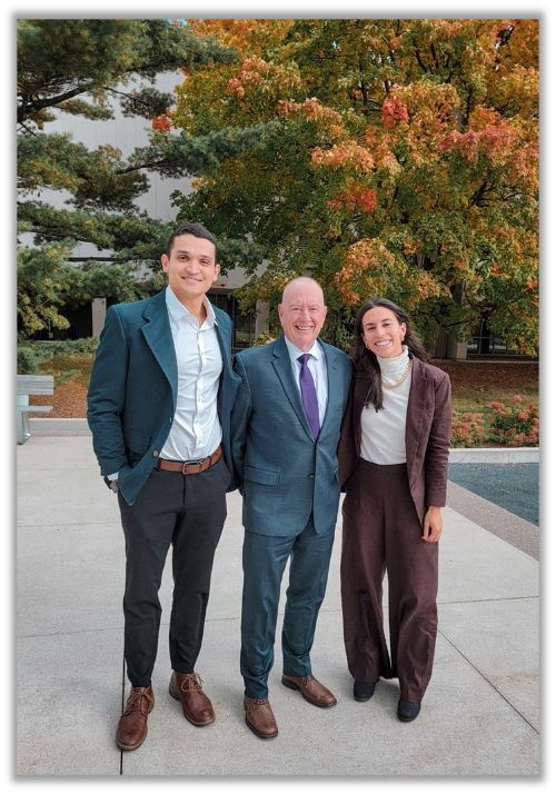 individuals standing for a photo