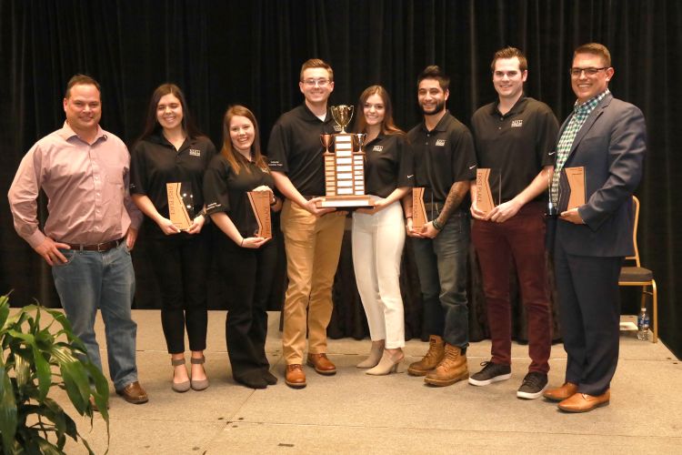 CM residential construction team holding the 1st place trophy.