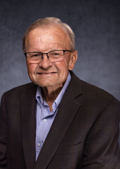 man in black jacket smiling