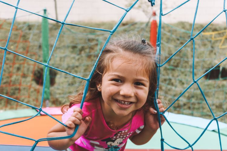 Girl on jungle gym