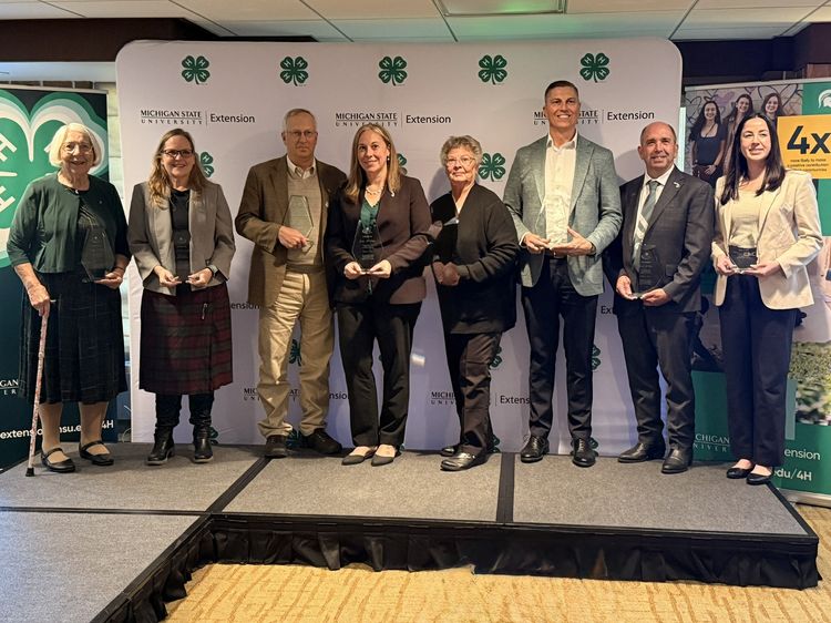 2026 Michigan 4-H Emerald Clover Society inductees. Left to right: Beverly Ferris Hain, Elizabeth Manwell, Dalen Agnew, Jackie Rider, Judith Paulsen, Benjamin LaCross, State Rep. Gerald Neyer and Emma Young.