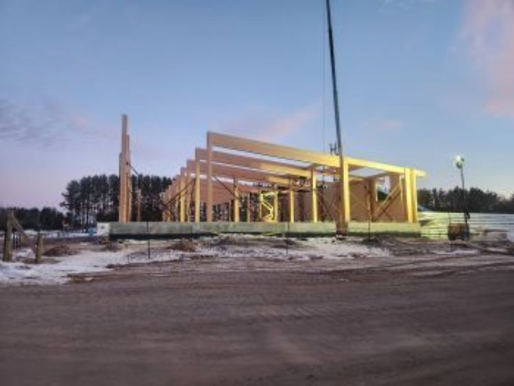 Exposed mass timber framing of the DNR Newberry building during construction.