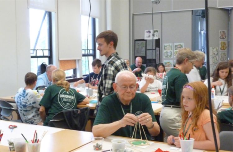 Photo of grandparents working with students on a landscape architecture project during MSU Grandparents University.