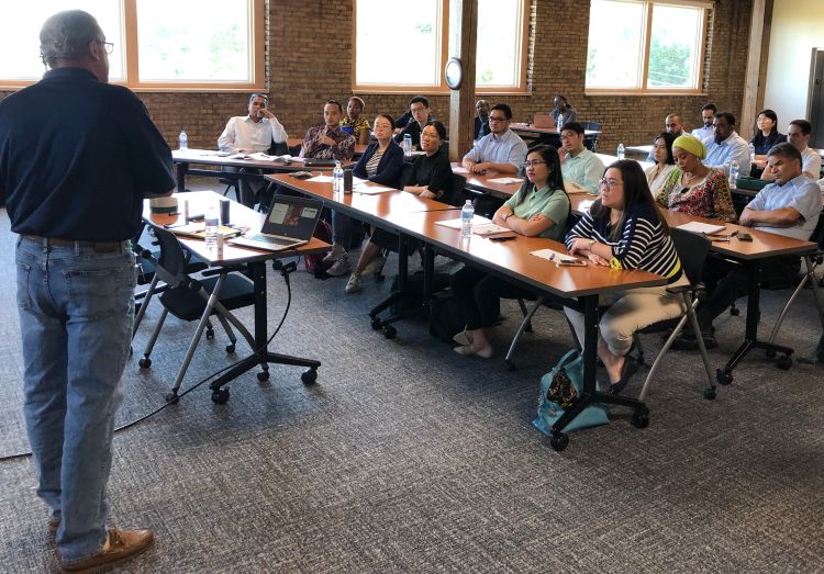 Attendees of the International Short Course in Food Safety listen to a presentation by Neogen Corporation representative Chuck Bird.