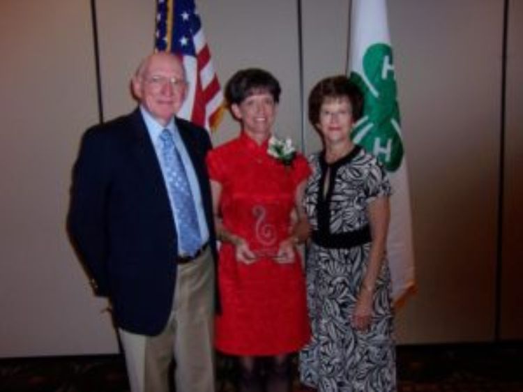 Faye and Wayne Adam with their daughter at the Emerald Clover Awards.